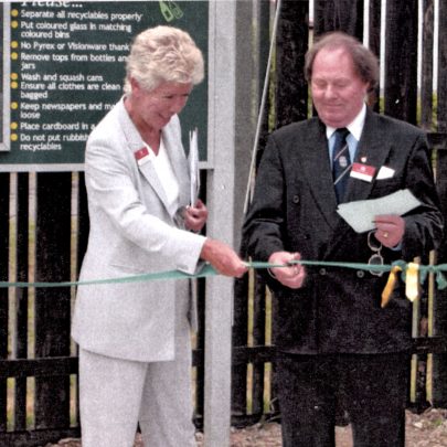Kay Twitchen assists Ray Howard with the cutting of the ribbon