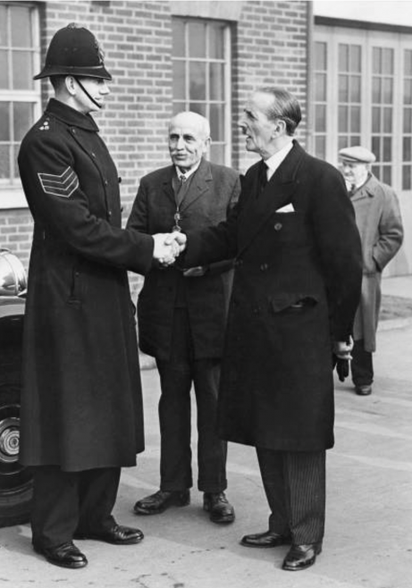 At 6 foot 6 inches Sergeant Howes was the tallest Canvey Policeman. He is pictured here being introduced to the Lord Mayor of London Sir Rupert De La Bere by Councillor Pickett. Sir Rupert congratulated William on his rescue work.