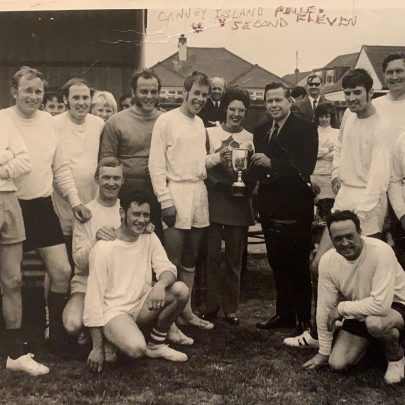 Bill Embley standing at the back 2nd in from the right. Gus Rushbridge holding the cup.