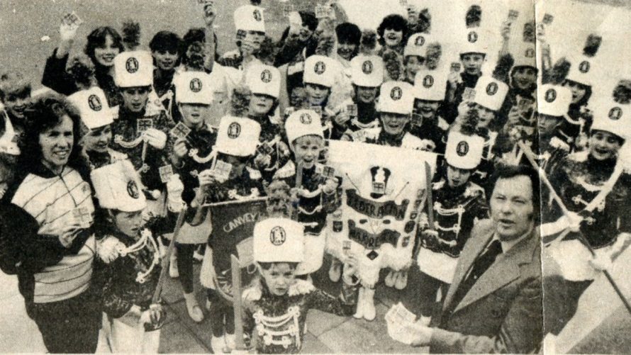 Showing the Flag: Coun Ray Howard presents the majorettes with their Union Jack Badges, before the troupe heads for Holland.