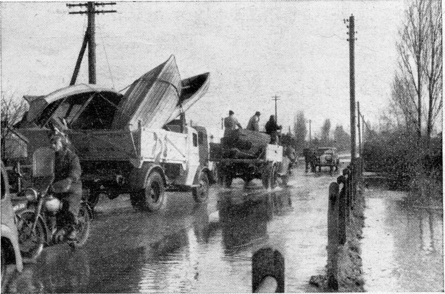 To the rescue. Throughout the morning craft of all descriptions were rushed to Canvey Island from the mainland, lorry after lorry, laden with dinghies, rolling over the bridge. many were sent from Southend after a loudspeaker van had toured the streets appealing for assistance. | Shiner and Holmes