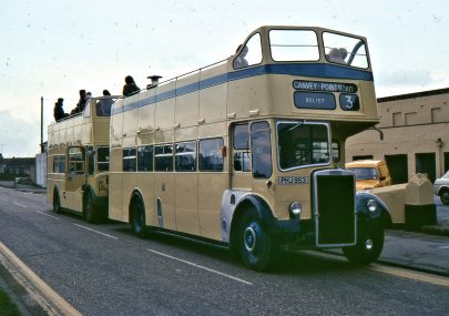 Two of Canvey's open top buses