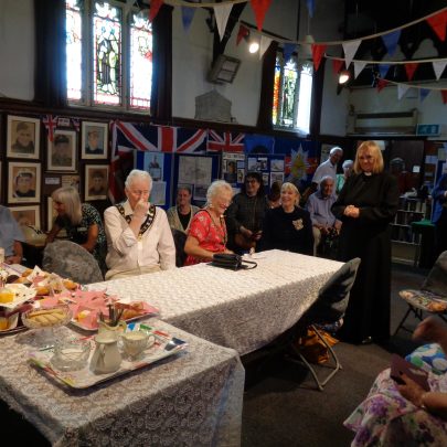 Some of the guests enjoying the cakes and tea.