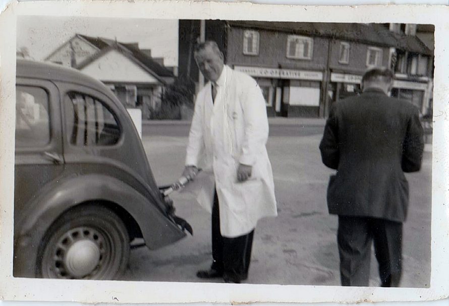 Dad on the forecourt showing the then closed Co-op Butchers in the background.