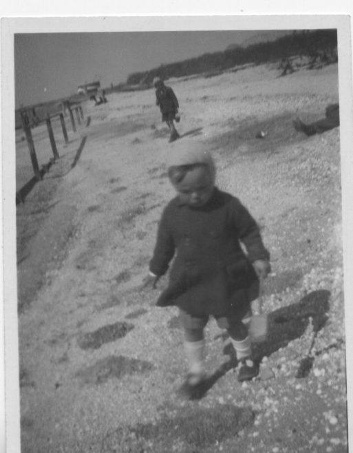 My sister on shell beach Canvey Labworth Cafe is in the background