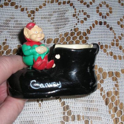 Black boot with Leprechaun sitting on front with the word Canvey.3