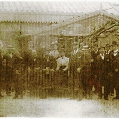 This poor copy shows Frederick Hester, the tall man in the centre, together with a formal party possibly of investors, when even the bread delivery man had to stand still. To the right, the rustic feel is expressed in the entrance surround.