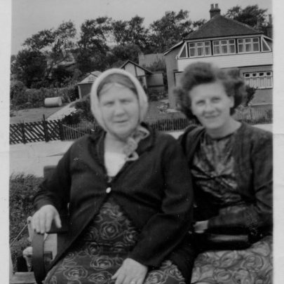 Clara's favourite seat on the seawall with her is Nell. Behind is a large house belonging to a jewish family | Marjorie Parks