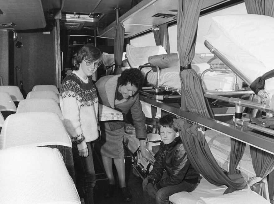 Tracy Comb and Brian Cassion being shown around the bus by Inez Mack from Across | Echo Newspaper Group