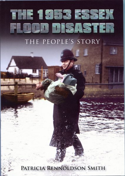 The front cover is a picture of PC Bill Pilgrim carrying a child from her flooded home on Canvey Island | Courtesy of Bob Pilgrim