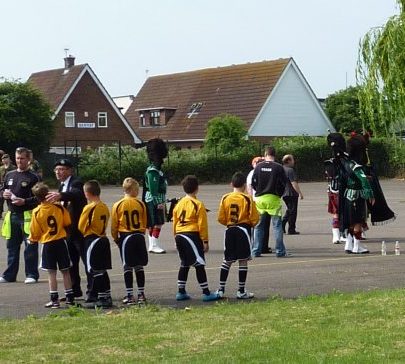 Canvey Island Boys and Girls FC and the Sutherland Pipe Band tuning up | Janet Penn