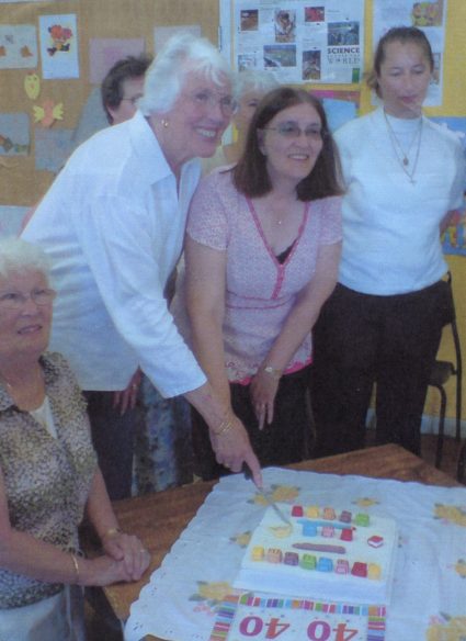 Pat Hurd (Pre-school Founder) and Pauline Beckwith (Pre-school Leader) cutting the birthday cake.