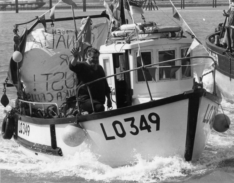 Wave of Approval: A friendly trawler man gives a wave. | Echo newspaper group and the Rayleigh Town Museum