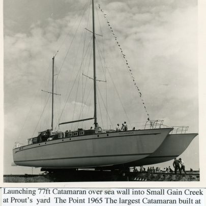 1965: Canvey Point at Prout's Yard in Smallgains Creek. The Launching of the largest Catamaran built at this time at 77ft | Ian Hawks
