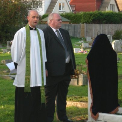 The Rev Tim Hide and Ian Mather waiting to unveil the refurbished headstone | Lesley Penn